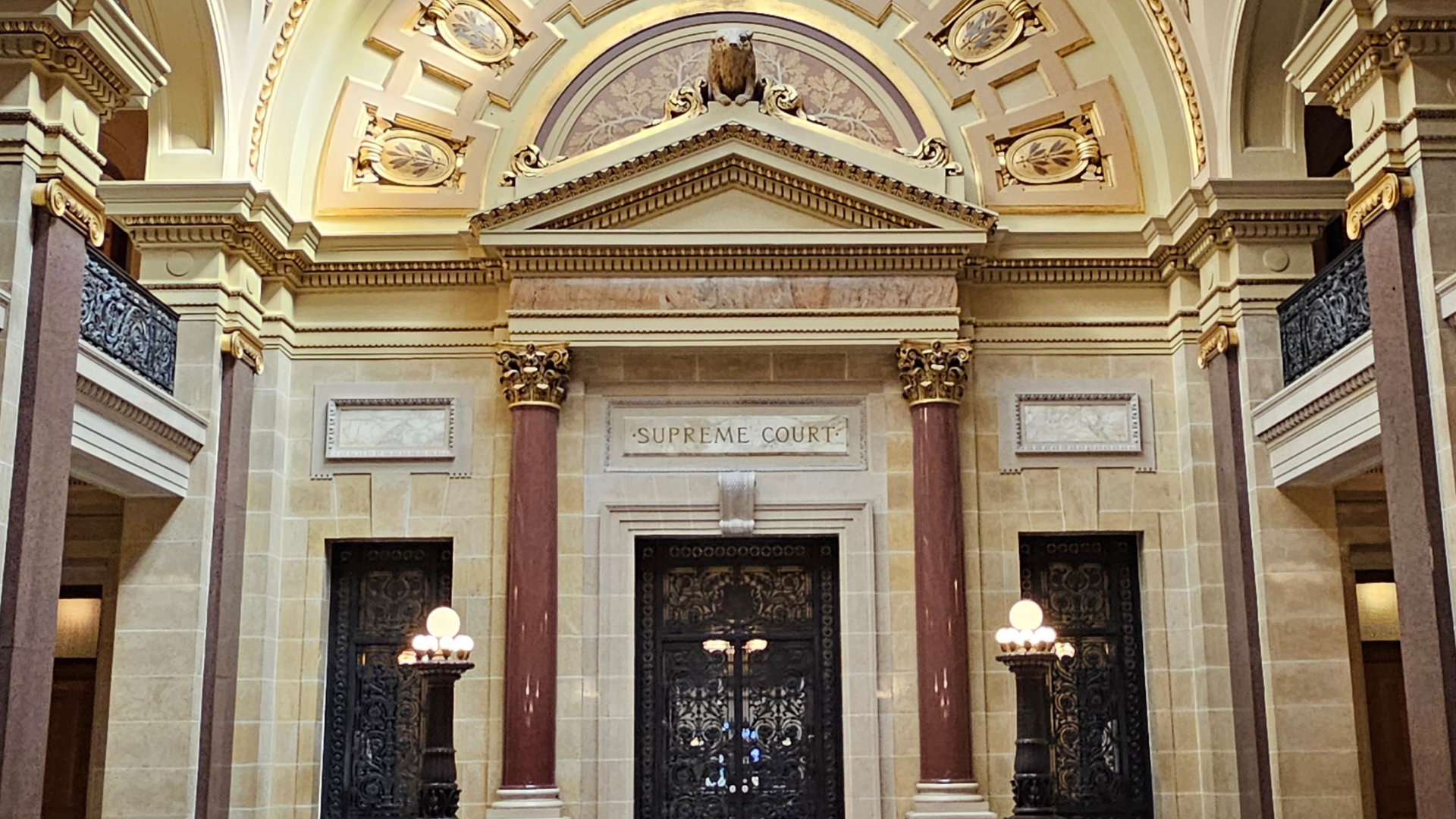 This image shows the entrance to the Wisconsin Supreme Court chamber in the state capitol building.