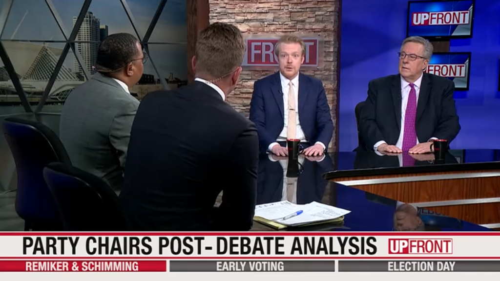 This image depicts State Dem Party Chair Devin Remiker and state GOP Chair Brian Schimming seated next to each other in a television studio speakign with "UpFront" hosts Gerron Jordan and Matt Smith.