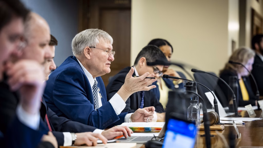 Image of state Sen. Van Wanggaard seated at a table in a Wisconsin State Capitol committee room.
