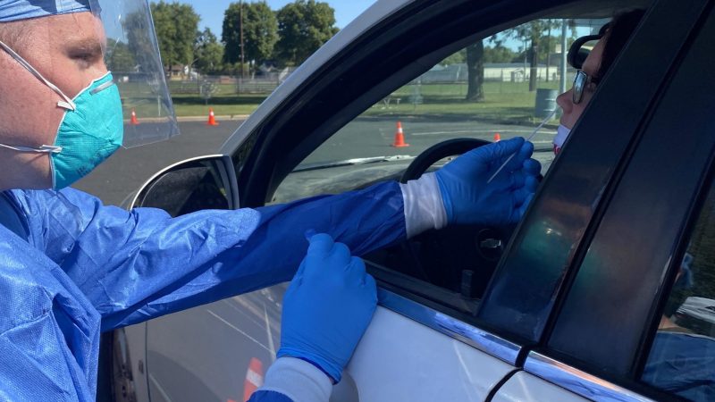 Jordan Beck, operational safety non-commissioned officer and healthcare specialist from Wisconsin Army National Guard’s 1st Battalion, 120th Field Artillery, collecting a sample at the Boscobel community testing site on Sept. 2, 2020/Stephanie Hoff