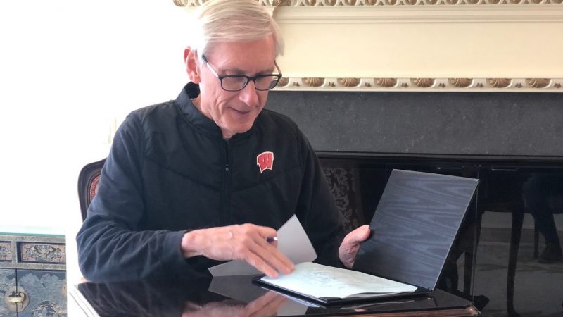 Gov. Tony Evers signs bipartisan legislation to address the COVID-19 pandemic April 15, 2020. Submitted photo.